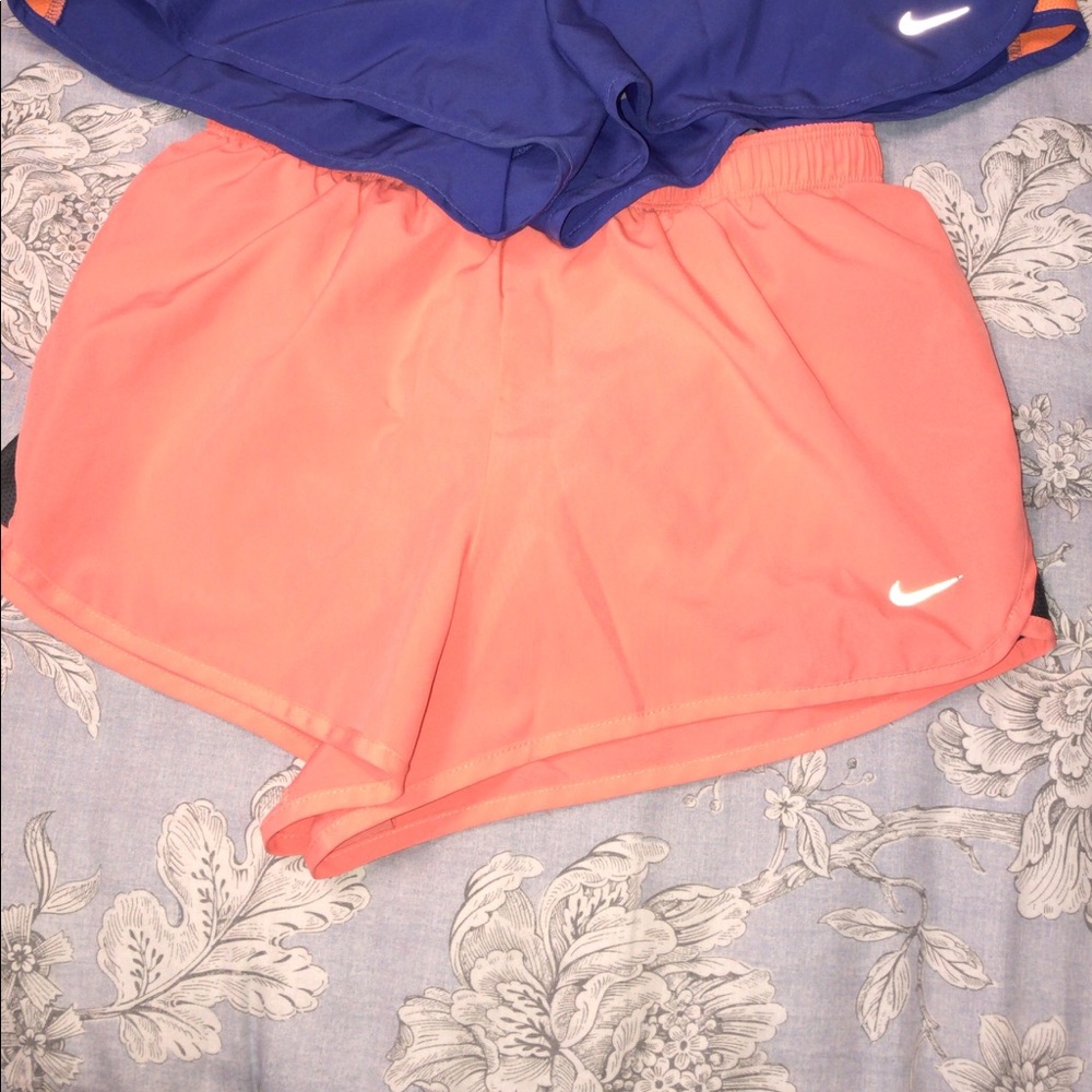 Orange Nike shorts with grey sides